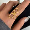 Anillo Elegante Europeo y Americano de Acero Inoxidable con Flor Hueca para Mujer, Anillo Abierto que No se Desvanece, Joyería Única de Acero de Titanio Color-Block