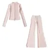 Fabricante mayorista de ropa para mujer transfronteriza 2026 cárdigan térmico de ajuste slim con cuello alto y cremallera y conjunto de pantalones de microcampana hasta el suelo