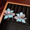 Pendientes de borla con flor de trébol de circonita vintage con un toque de alta gama, pendientes versátiles y de moda al por mayor
