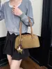 Bolso de mano versátil retro nuevo de principios de otoño Yuezhi, bolso de hombro moderno, bolso de axila para mujer simple y texturizado para el trabajo