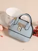 Nuevo monedero de alta gama para mujer, bolsa creativa para monedas, bolsa con llavero, versión japonesa y coreana, mini bolsa simple y linda para auriculares