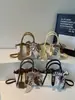 Bolsas pequeñas transfronterizas populares para mujer de este año, nuevos bolsos cruzados versátiles de moda para el verano de 2026, bolsos tipo cubo de estilo coreano