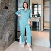 Primavera pijamas nuevos para mujer tipo seda manga larga color sólido encaje traje INS ropa de casa fábrica entrega de una pieza
