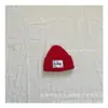 Outono e inverno de 2024 gorro de malha estilo acadêmico simples para crianças etiqueta de tecido grande para meninos e meninas gorro quente de lã pullover frio atacado