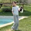 Camiseta informal de manga corta para niñas, estilo coreano simple de tres botones, nueva para 2026, para niños mayores, ropa infantil transfronteriza de moda