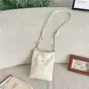 67314 Bolso cruzado de encaje hueco estilo francés con correa ajustable, bolso pequeño de tela suave para teléfono y monedas