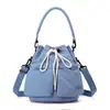 Nueva colección Otoño/Invierno 2026: Bolsa tote pequeña estilo coreano, diseño de nicho, para mujer, bolso de hombro, bolso cruzado y bolso tipo cubo para ir al trabajo