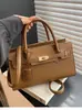 Bolso de Mano con Patrón de Lichi Transfronterizo para Mujer 2026 Nuevo Bolso de Hombro Cruzado de Moda Europea y Americana Elegante Bolso Kelly para Viajes Diarios para Mujer