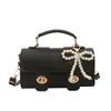 Versátil Bolso Nuevo para Mujer 2026 Nueva Moda Estilo Retro Bolso de Mano Cuadrado Pequeño con Acabado de Alta Gama, Bolso de Hombro y Cruzado