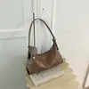 Bolso de mano minimalista de nicho estilo coreano para mujer, nuevo de moda principios de otoño 2026, de alto valor, bandolera casual de color sólido