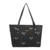 Nova bolsa tote de lona jeans estilosa para mulheres, com um design fofo de laço, versátil e fácil de combinar com qualquer look, com grande capacidade e alça de ombro casual