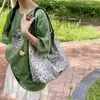 Bolso de mano informal a rayas con estampado de leopardo para mujer 2026 Nuevo de gran capacidad, versátil, para el hombro, para ir al trabajo y el ocio, bolso de axila