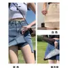 Shorts Jeans 2026 Verão Novo Estilo Linha A Cintura Alta Fenda Slim Fit Justo no Quadril Meia Saia Roupa Externa Feminina Saia-Calça Curta