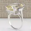 Anillo de compromiso de mujer con imitación de topacio y circonita cúbica, chapado en cobre y platino, venta al por mayor de fábrica, joyería de moda europea y americana muy vendida.