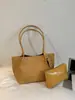 Bolsa de mano tejida de gran capacidad transfronteriza, moderna, casual, versátil, adecuada para ir al trabajo, bolso de hombro de moda de nicho, bolso de axila elegante