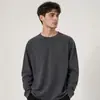 Camiseta de manga larga para hombre, color liso, cuello redondo, versátil, holgada, casual, moderna, simple, para otoño e invierno, venta al por mayor del fabricante