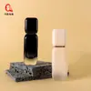 Botella Cuadrada de Vidrio con Fondo Grueso y Cabeza de Bomba de Prensa 30ml Color Gradiente para Piel Botella de Base Líquida Botella de Loción Esencial Fabricante Venta al por Mayor