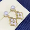 Pendientes de perlas naturales de agua dulce con aguja de plata S925, diseño de nicho, temperamento de alta sensibilidad, pendientes de mariposa blanca de agua de mar natural.
