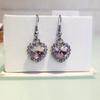 Aretes de moda europea y americana con forma de corazón de cristal austriaco, aretes de aleación, corazón de gema oceánica, venta al por mayor