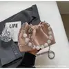 Bolsa de corrente tipo balde design de nicho feminina 2024 Nova celebridade da internet bolsa transversal ins popular este ano bolsa pequena para o dia a dia