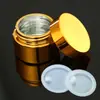 Venta al por mayor de botellas de aceite esencial chapadas en oro, prensa de emulsión, atomizador de perfume, cuentagotas, subembotellado de cosméticos