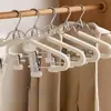 Novo cabide com prendedores para uso doméstico, uma ferramenta mágica para pendurar calças e saias no guarda-roupa, cabide com prendedor antiderrapante para saias, fácil de usar