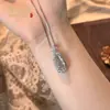 Pingente Natural de Jade Gelo Alto Feijão Fu Inlaid com Ovo de Pombo Novo Estilo Chinês Temperamento de Luxo Leve Banhado a Prata Inlaid com Buda