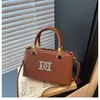 Bolso de hombro de alta calidad, simple, de color liso y moderno, versátil y a la moda para el uso diario, bolso cruzado para mujer, bolso de mano estilo transfronterizo