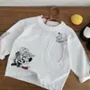 Camiseta Manga Longa Infantil T2026 Outono Nova Desenho Animado com Bolso Gola Redonda Camiseta Básica para Meninos e Meninas, Camiseta Versátil para Bebê, Roupa Infantil