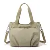 Bolsa de tela de nailon de gran capacidad para uso casual y para ir al trabajo para mujer, modelo nuevo 2026, bolsa para clase de estudiante universitario, bolsa de hombro tipo tote para ir al trabajo
