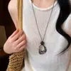 Collar con colgante de madera geométrico retro de estilo étnico, sensación de lujo ligero y alta gama, cadena para suéter, accesorio versátil de nicho y único para mujer
