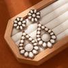 Pendientes de turquesa con flores huecas transfronterizas europeas y americanas, pendientes bohemios de alta gama para fiestas, de moda exagerada.