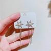 2023 nuevos aretes populares de otoño e invierno con borla de copo de nieve y perla, aretes únicos con clip para la oreja sin perforación, aretes de lujo ligero de alta gama