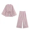 Al por mayor 2026 Primavera Nuevo Estilo Europeo y Americano Conjunto de Top Rayado Casual para Mujer + Pantalones 10426