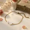 O Melhor Presente de Dia dos Namorados: uma Pulseira Artesanal Feita de Conchas Coração de Pêssego com um Design de Emenda de Pérolas Que Simboliza a Beleza