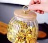 Entrega de fábrica Tarro sellado de vidrio de borosilicato alto vidrio resistente al calor tapa de bambú tarro para té tarro triangular tarro de almacenamiento botella de almacenamiento