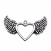 47x 29mm 4.5g comercio exterior AliExpress explosiones calientes colgante de corazón de amor alas de amor huecas