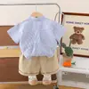 Traje de verano de manga corta para niños 2025 Nuevo Informal Coreano para Niños Atractivo Perro Vertical Dos Piezas Bebé Moderno