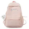 Nueva mochila bordada con letras color rosa flor de cerezo para estudiantes de secundaria y preparatoria, bolsa de viaje casual versátil para mujeres, mochila ligera