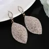 E-commerce transfronteiriço fornece joias moda tendência brincos femininos requintados olhos de cavalo garra de strass corrente brincos totalmente cravejados E615