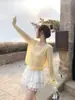 Suéter de Tricô Verão Proteção Solar Saída de Praia para Mulheres 2026 Novo Estilo Leve Camiseta de Verão com Camisola Roupa de Fora Top em Branco