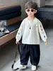 Camiseta de manga larga estampada para niños, primavera y otoño, estilo coreano, diseño de bloques de color, top casual para niños pequeños y niños, calidad de exportación
