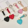 Llavero de Corazón de Diamante Completo de Venta Caliente Cross Colgante de Bolso de Corazón de Melocotón con Pedrería Llavero de Coche Personalidad de Moda Colgante