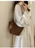 Bolso tote hueco de vacaciones ins elegante 2026 cesta de verduras bolsa de playa tejido a mano moda holiday un solo hombro