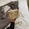 Bolso de cadena con patrón de rombos, bolso tipo cubo de alta moda estilo coreano, nuevo bolso de hombro y cruzado de moda nicho para mujer primavera 2026