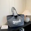 Bolsa de Tote Grande de Rayas Doble Cara con Letras Coreanas 2026 Mismo Estilo que las Celebridades de Internet Bolsa de Hombro Único Estilo Perezoso Bolso de Mujer Tela