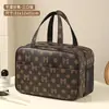 Bolsa de maquillaje de celebridad de Internet 2026, portátil, simple y elegante, gran capacidad, neceser impermeable, bolsa de almacenamiento de cosméticos estampada