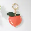 Chaveiro de Frutas Fofo Cereja Maçã Pêssego de Couro com Pingente Capa Protetora para Airtag Charme de Bolsa Venda Quente Transfronteiriça