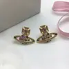 Novos Brincos Saturno Transfronteiriços da Rainha Mãe para Mulheres, Agulhas de Prata 925, Luxo de Alto Padrão, Brincos Planeta Vivienne Minimalistas