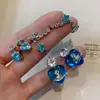 Brincos Saturno Coração Azul Zircônia para Mulheres Design de Nicho Sexy de Alta Qualidade Brincos de Clipe para Cartilagem Auricular Planeta Elegante para Mulheres
